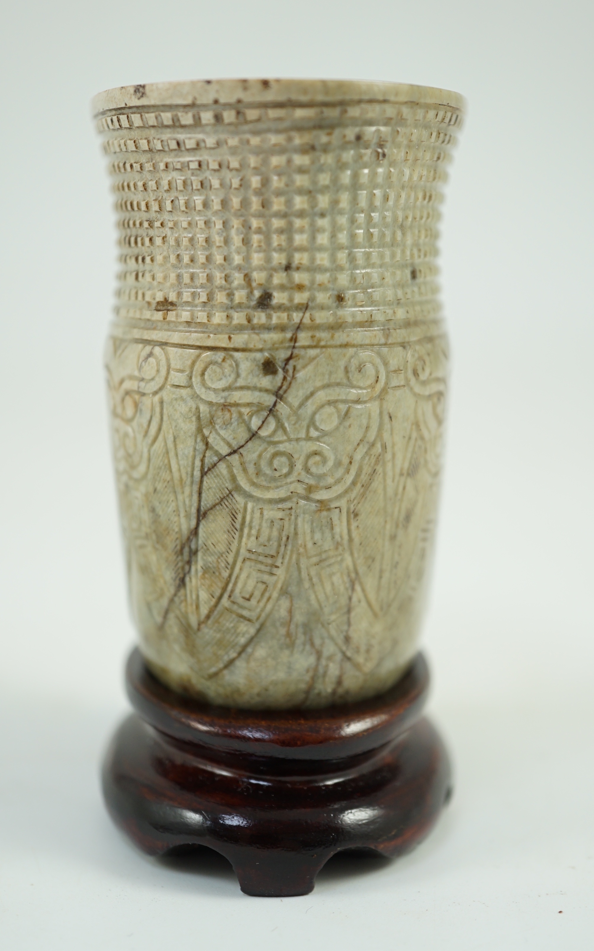 A Chinese archaistic burnt ‘chicken bone’ jade oval cup, chan, probably Song dynasty, 7.1 cm high, small chip repair